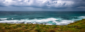 Wild Atlantic coastline with ocean waves and coastal vegetation in Gabon