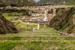🏔️ Ollantaytambo Ruins & Sacred Valley Adventure Guide 2 View from the ancient Inca terraces overlooking Ollantaytambo town and archaeological ruins in Peru’s Sacred Valley