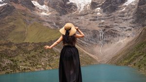 Machu Picchu & Sacred Valley Mountain Adventures: Hiking, Scenery & Outdoor Experiences 6 Traveler overlooking the turquoise waters of Humantay Lake beneath dramatic snow-capped Andean mountains near Machu Picchu, Peru.