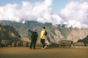 Machu Picchu & Sacred Valley Mountain Adventures: Hiking, Scenery & Outdoor Experiences 4 this works nicely for the 🥾 Hiking the Legendary Inca Trail section. The hikers and huge cloud-covered Andean mountains emphasize the outdoor journey and scenery.
